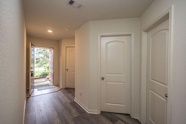 corridor with dark wood-type flooring