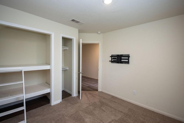 unfurnished bedroom featuring carpet flooring