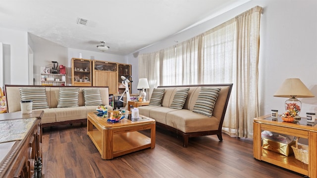 living room with dark wood-type flooring