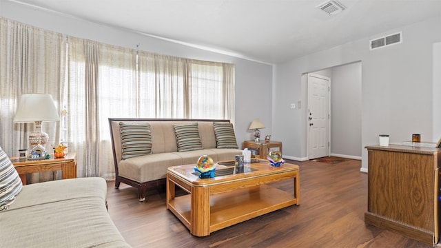 living room featuring dark hardwood / wood-style floors