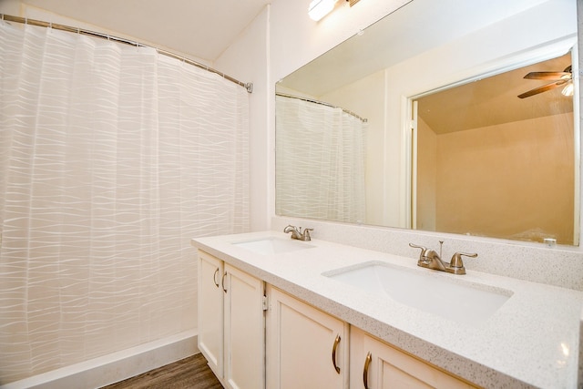 bathroom featuring vanity, hardwood / wood-style flooring, and ceiling fan