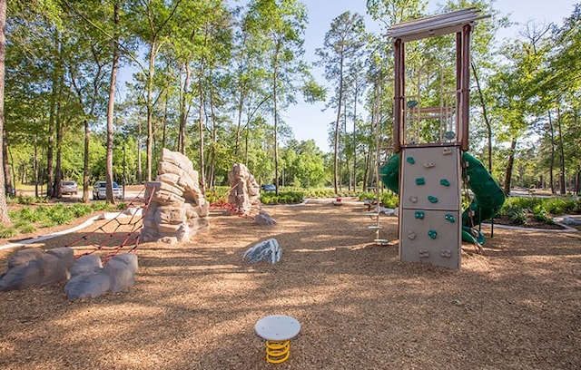 16651 Yaklin Meadow Ct, Humble, TX 77346 - community jungle gym featuring view of scattered trees