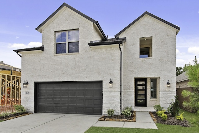 16651 Yaklin Meadow Ct, Humble, TX 77346 - view of front of house featuring an attached garage, driveway, and brick siding