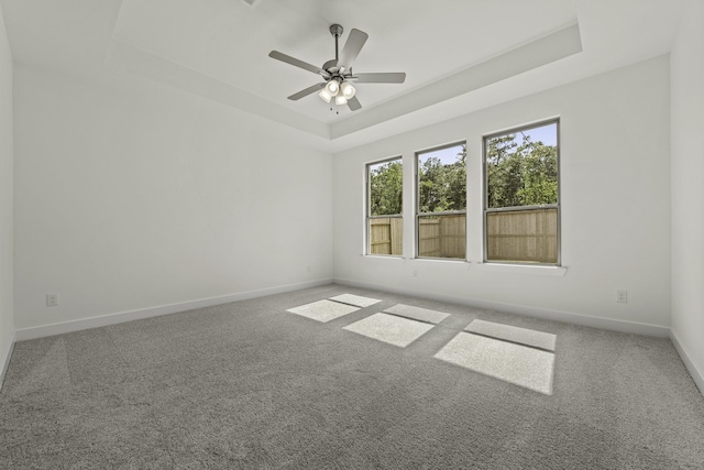 16651 Yaklin Meadow Ct, Humble, TX 77346 - carpeted empty room with a tray ceiling and ceiling fan