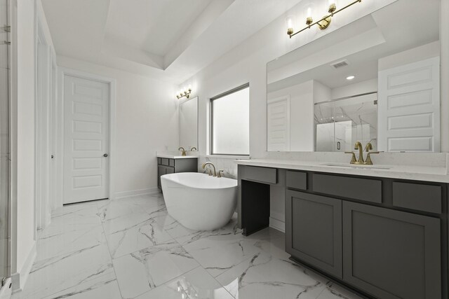 16651 Yaklin Meadow Ct, Humble, TX 77346 - bathroom featuring a marble finish shower, two vanities, a soaking tub, marble look tile flooring, and recessed lighting