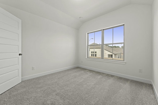 16651 Yaklin Meadow Ct, Humble, TX 77346 - carpeted spare room featuring vaulted ceiling and baseboards