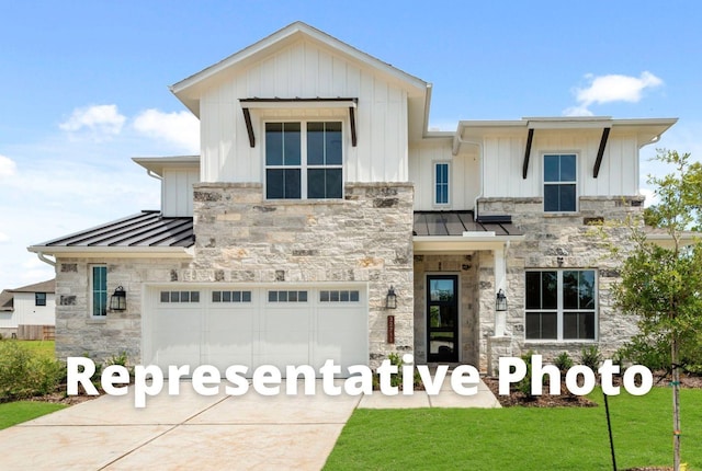 modern farmhouse with stone siding, a standing seam roof, and metal roof