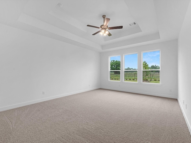32602 Fly Fish Way, Fulshear, TX 77441 - unfurnished room with a raised ceiling, light carpet, and ceiling fan