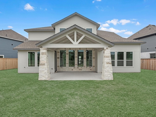 32602 Fly Fish Way, Fulshear, TX 77441 - back of property with a shingled roof, a fenced backyard, a patio, and stone siding