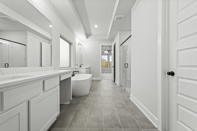 bathroom featuring tile patterned flooring, vanity, and separate shower and tub