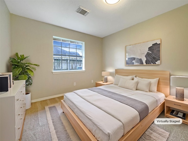 bedroom featuring light carpet