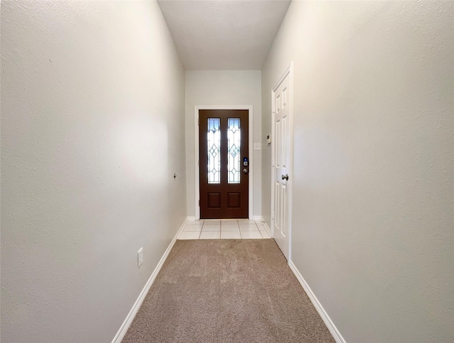 doorway with light carpet