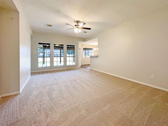 unfurnished living room featuring ceiling fan and carpet flooring