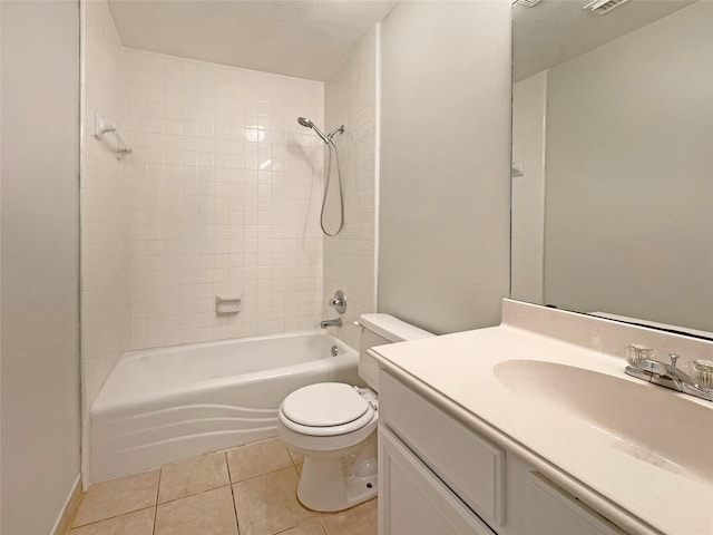 full bathroom featuring vanity, toilet, tiled shower / bath combo, and tile patterned flooring