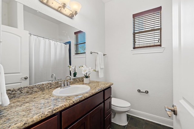 bathroom with tile patterned floors, toilet, and vanity