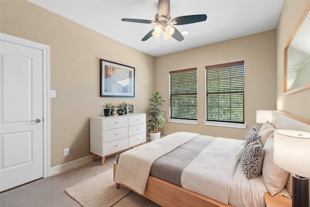 bedroom with ceiling fan and carpet floors