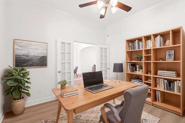 office area featuring french doors, ornamental molding, ceiling fan, and light hardwood / wood-style flooring