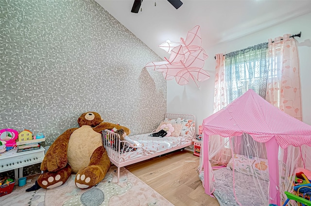 bedroom with hardwood / wood-style flooring and ceiling fan