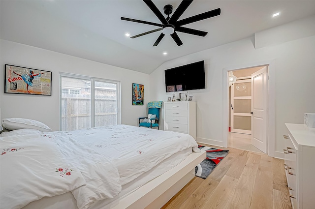 bedroom featuring vaulted ceiling, ceiling fan, and light wood-type flooring