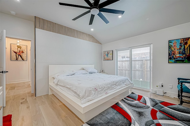 bedroom with light hardwood / wood-style flooring, ceiling fan, and vaulted ceiling