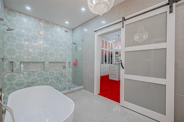 bathroom with tile walls, tile patterned floors, and plus walk in shower