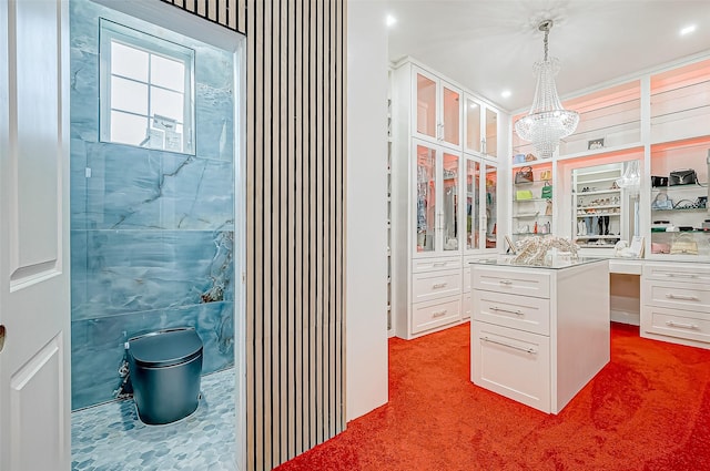 bathroom with a chandelier