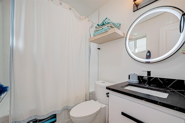 full bathroom featuring shower / tub combo, vanity, and toilet