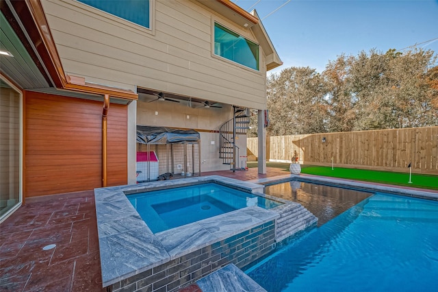 view of swimming pool with an in ground hot tub and a patio area