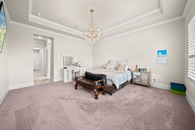 carpeted bedroom with ornamental molding, a tray ceiling, and a notable chandelier