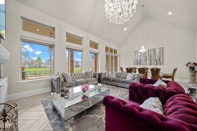 living room with light parquet floors, high vaulted ceiling, and a chandelier