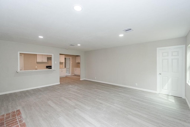 unfurnished living room featuring light hardwood / wood-style flooring