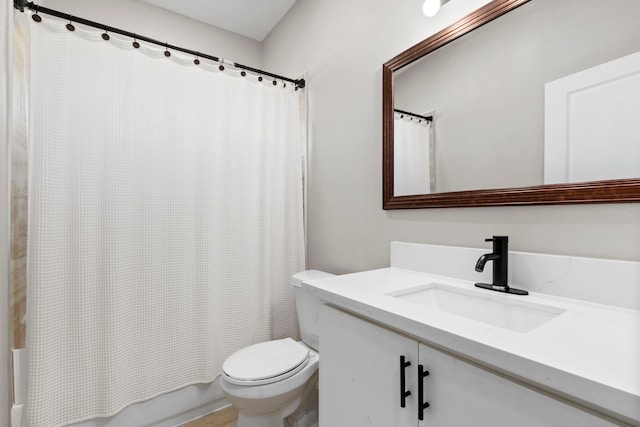 full bathroom with vanity, shower / bathtub combination with curtain, and toilet