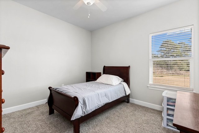 bedroom featuring light colored carpet and ceiling fan