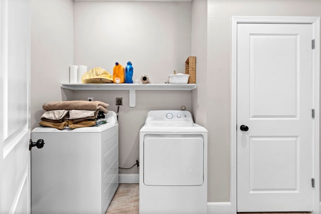 washroom with washer and dryer