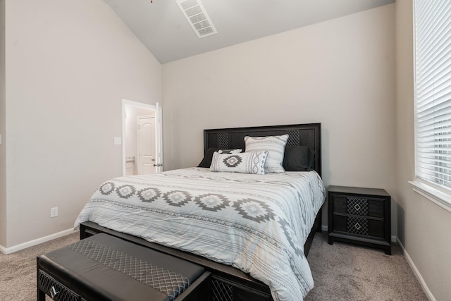 carpeted bedroom with vaulted ceiling