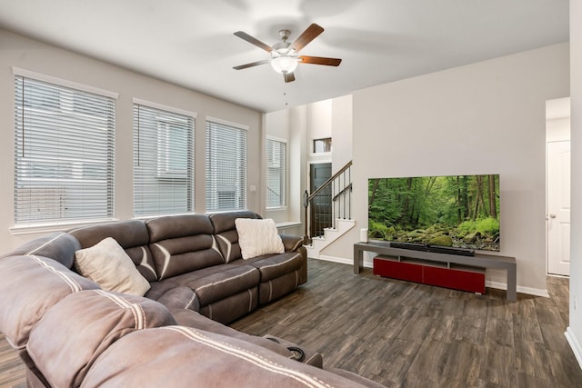 living room with dark hardwood / wood-style floors and ceiling fan