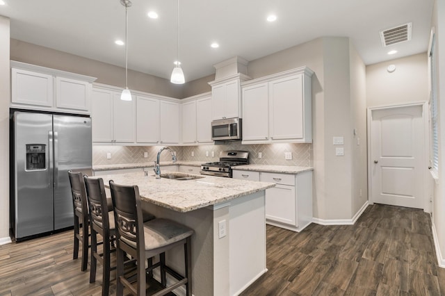 kitchen featuring white cabinetry, sink, and appliances with stainless steel finishes