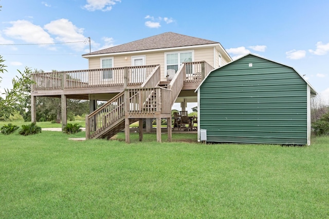 rear view of house featuring a lawn and a deck