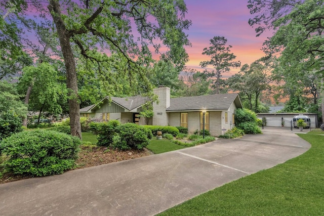 view of front of property with a yard