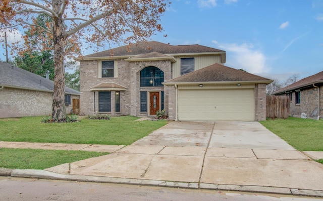 front facade featuring a garage and a front yard