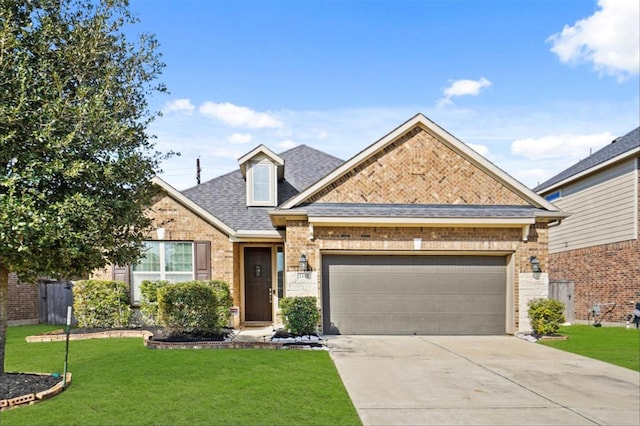 view of front of home featuring a garage and a front lawn