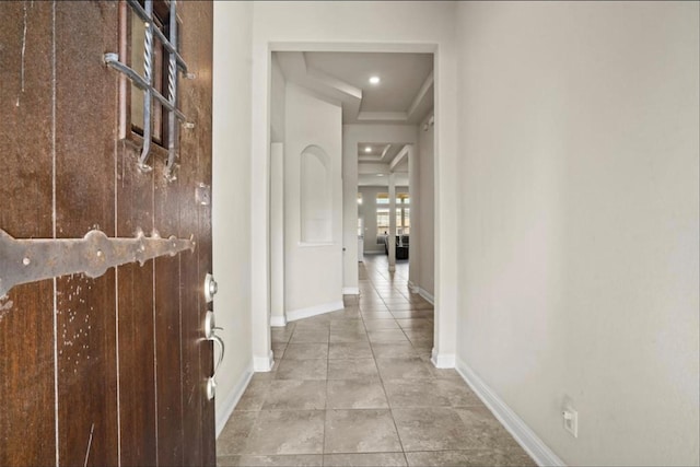 hall with light tile patterned flooring