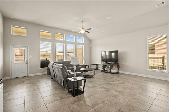 living room featuring light tile patterned floors, vaulted ceiling, and ceiling fan