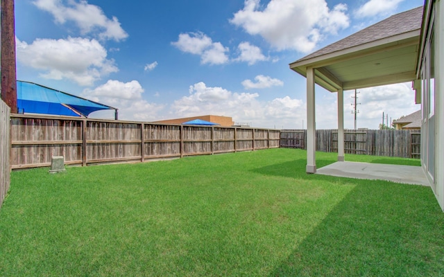 view of yard with a fenced backyard and a patio area