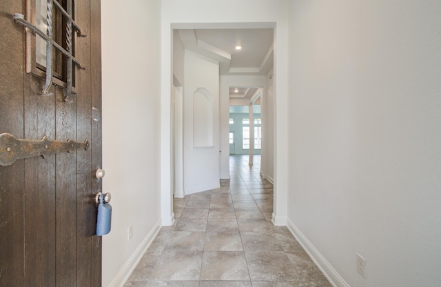 hall featuring baseboards