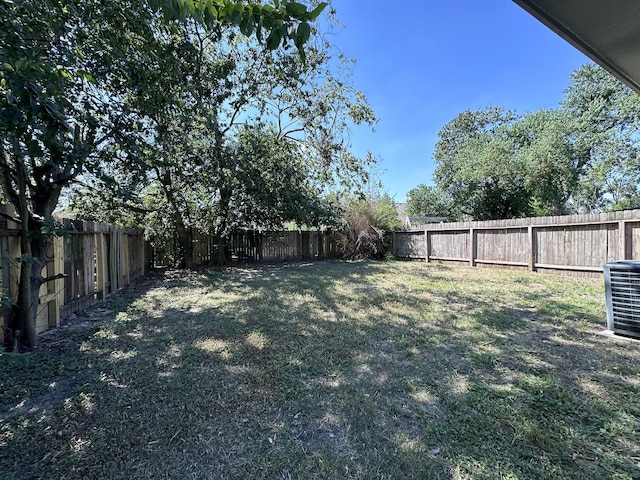 view of yard with central AC unit