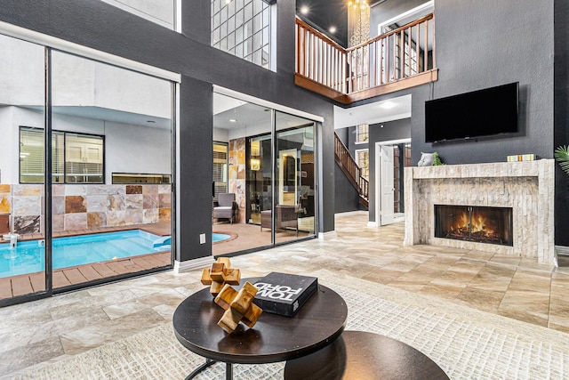 living room featuring a high ceiling