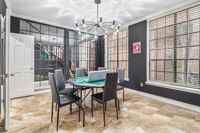 dining space featuring crown molding, a notable chandelier, and a textured ceiling