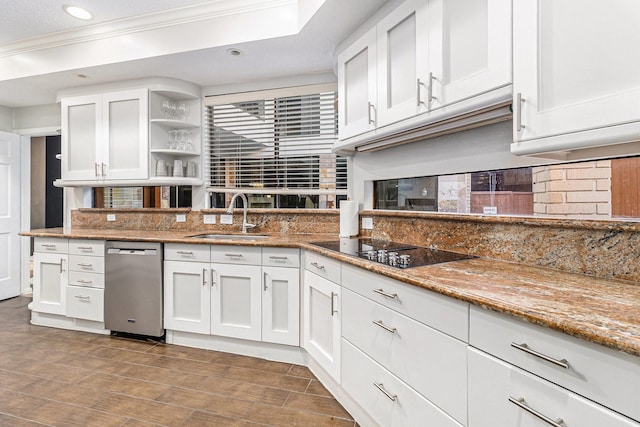 kitchen with sink, backsplash, white cabinets, stainless steel dishwasher, and light stone counters