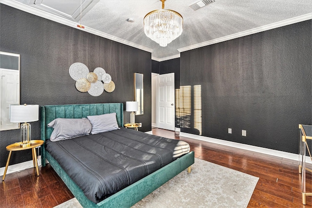 bedroom featuring crown molding, an inviting chandelier, and dark wood-type flooring